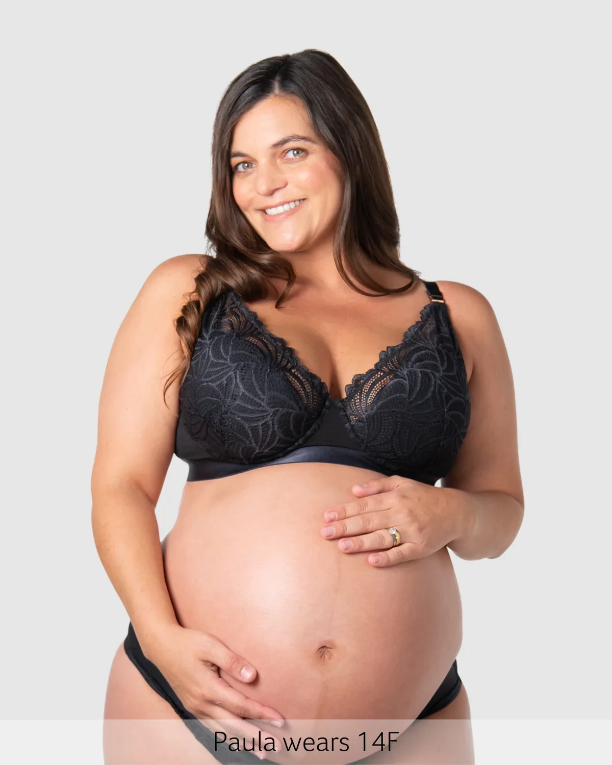 A mum wearing the hotmilk warrior plunge maternity bra in black