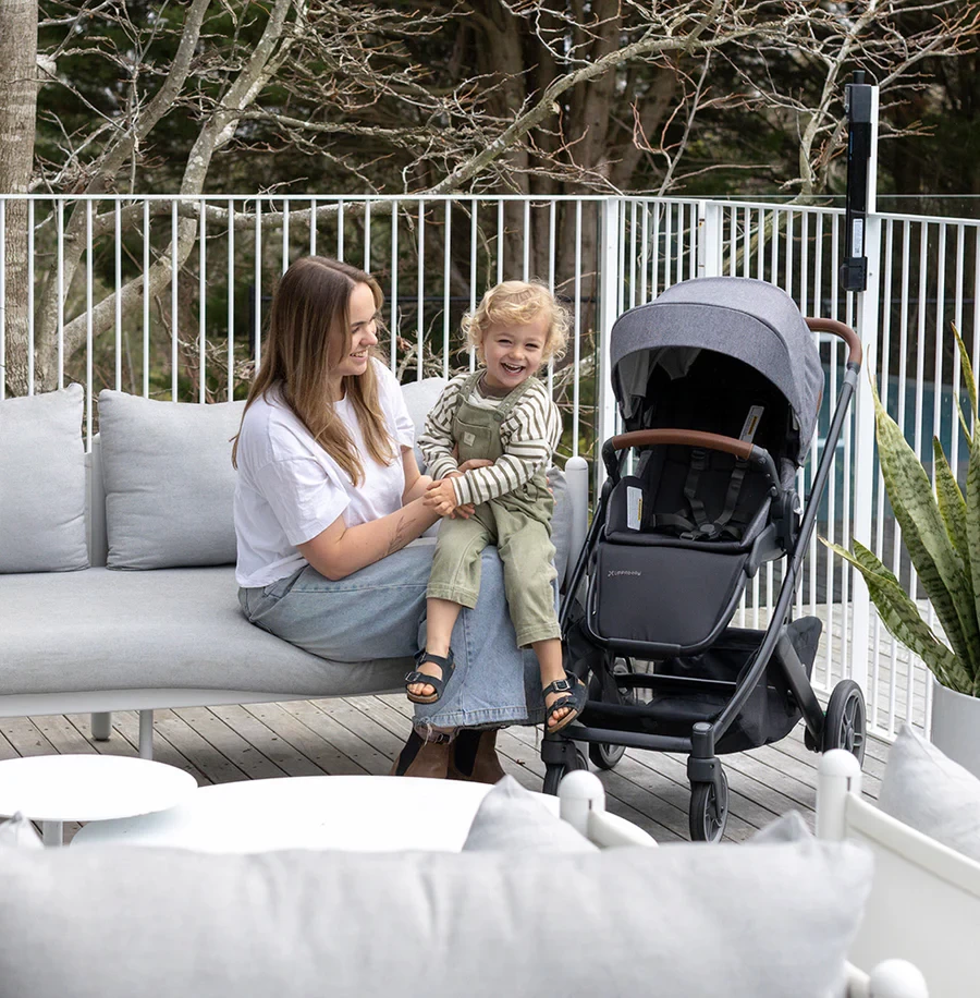 The Uppababy Cruz V3 pram next to an Australian mum and baby