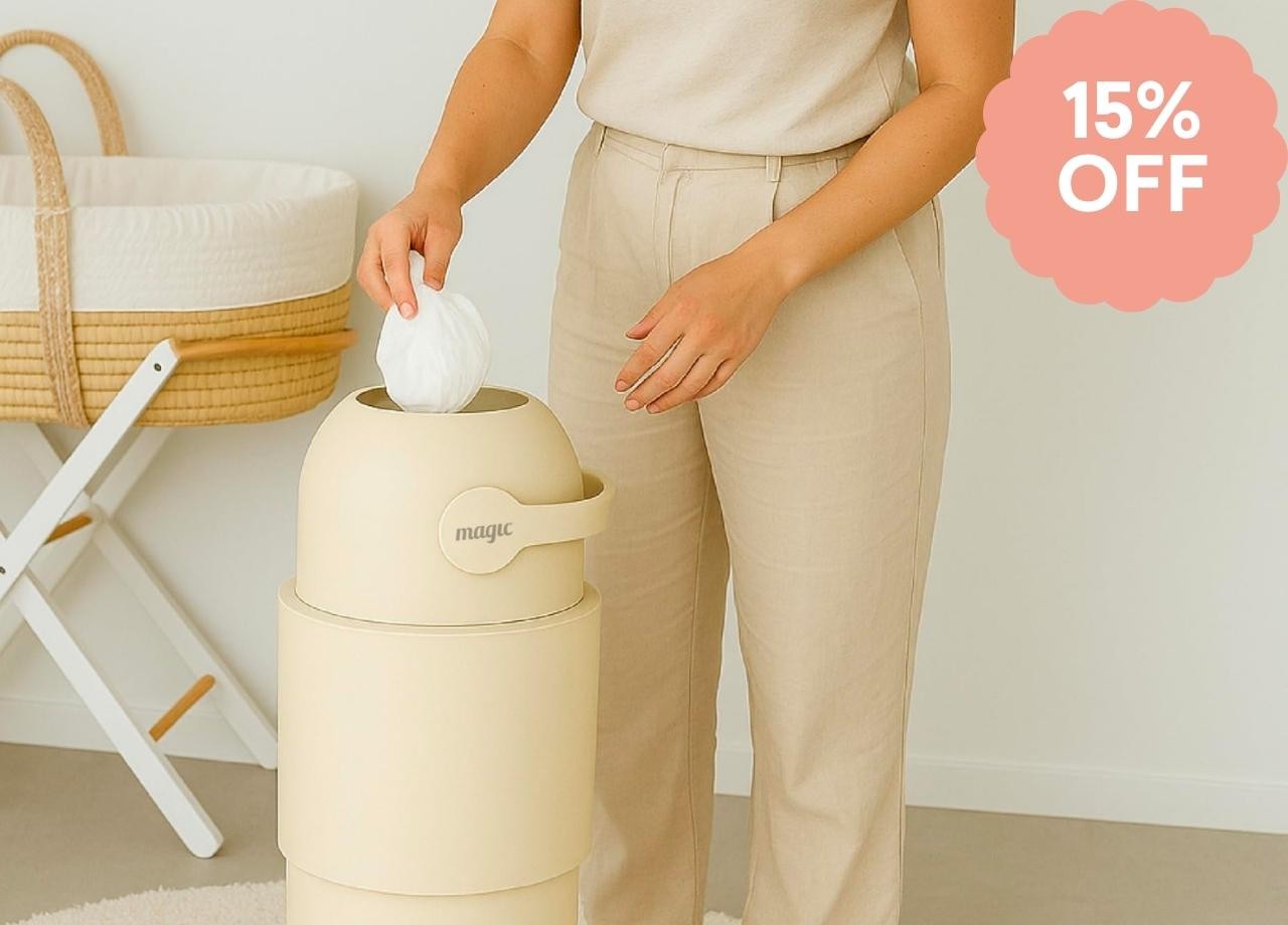 A mum putting a nappy in a Heka nappy bin