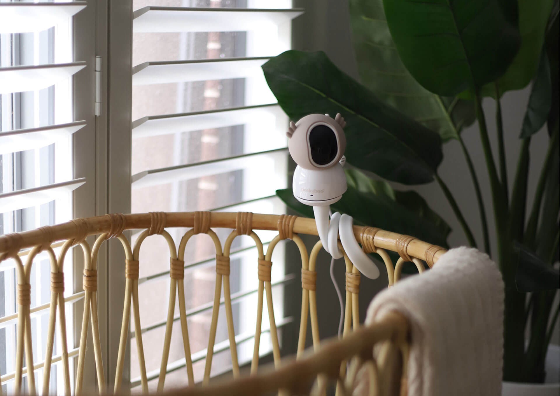 Peekyboo Baby Monitor Camera attached on a baby bassinet – the best baby monitor for clear video and peace of mind.