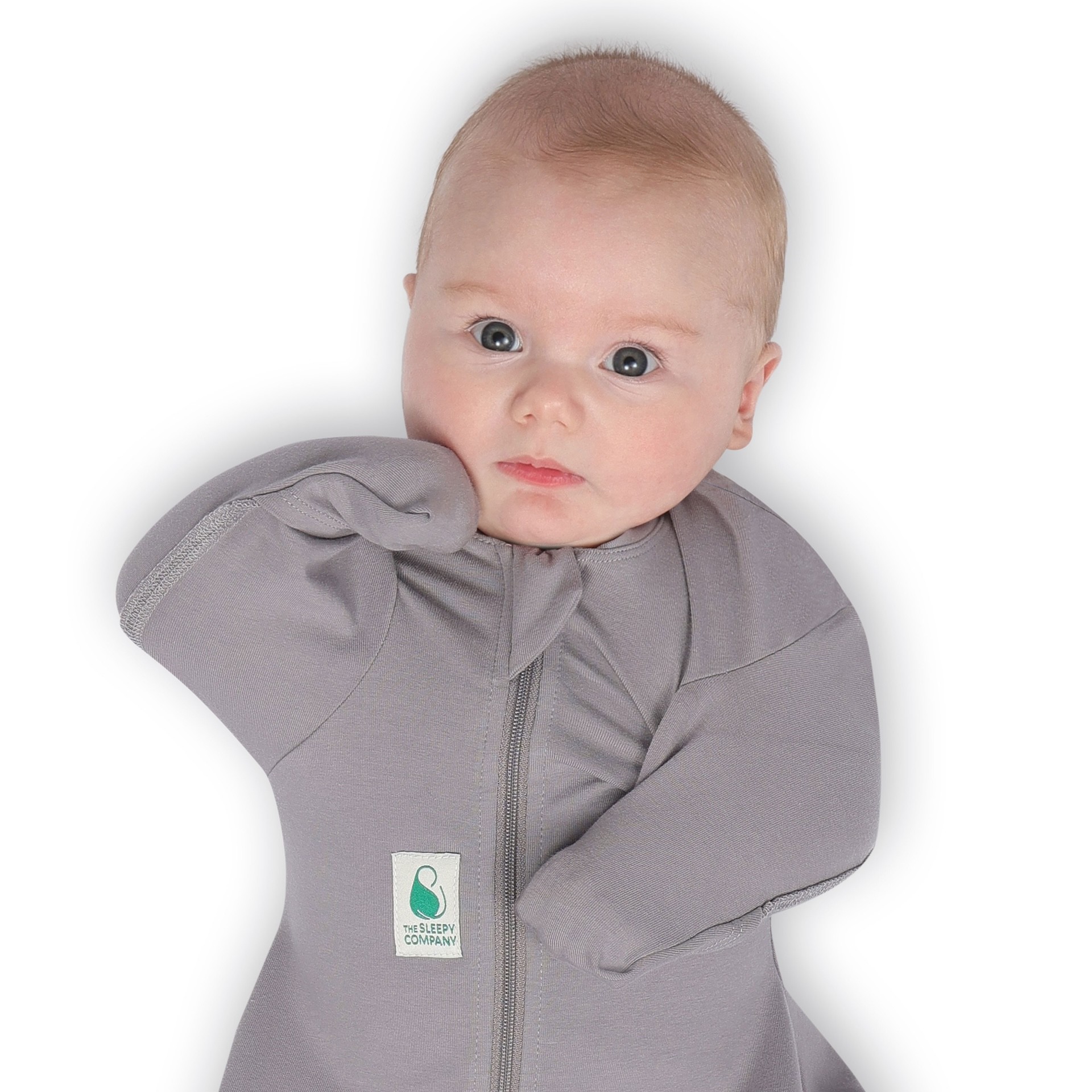 A baby wearing a grey FX swaddle