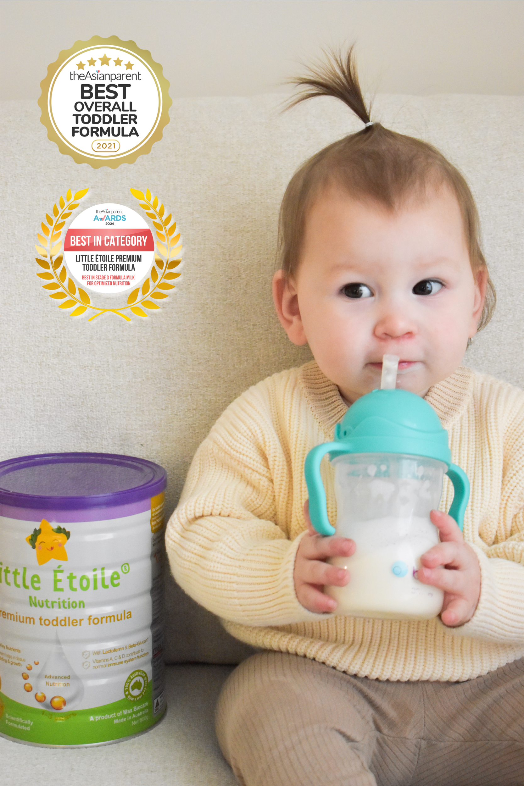 Baby enjoying feeding time with Little Étoile Nutrition Premium Toddler Formula can in hand and bottle in mouth.