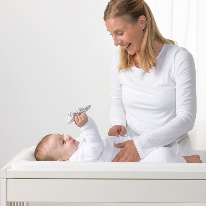 Ikea Vaedra baby changing mat being used by a mum and her baby