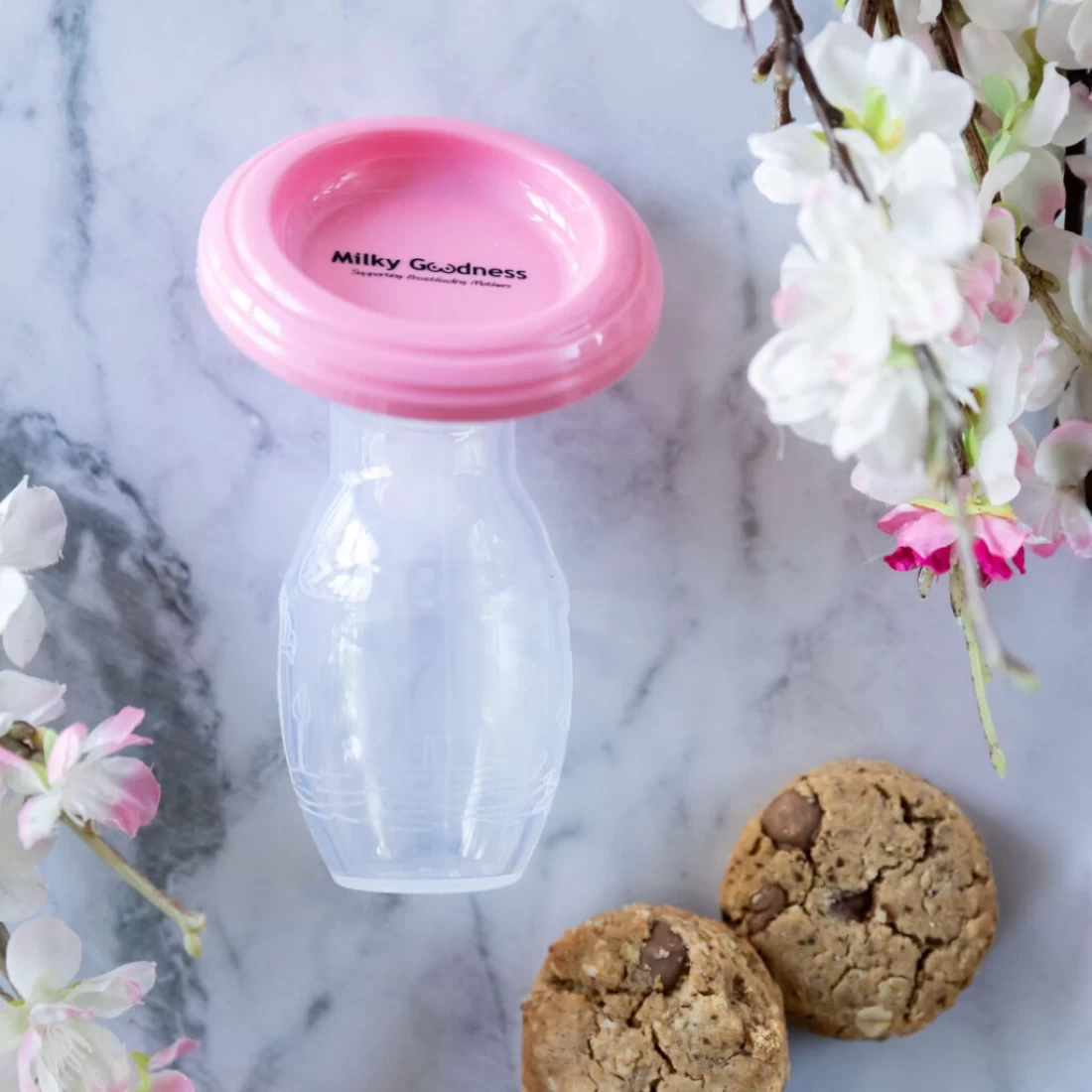 Milky Goodness Best Breast Pump Milk Saver paired with lactation cookies for breastfeeding mums.