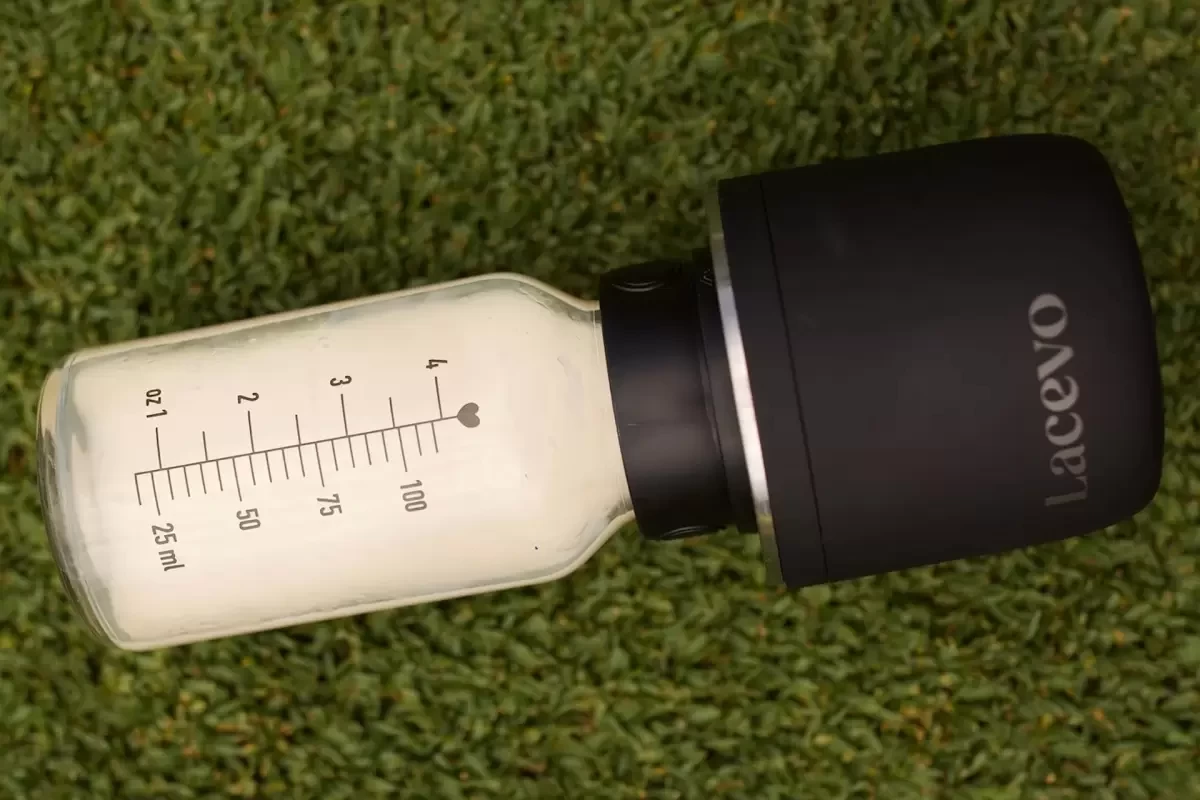 A baby bottle warmer with milk in it