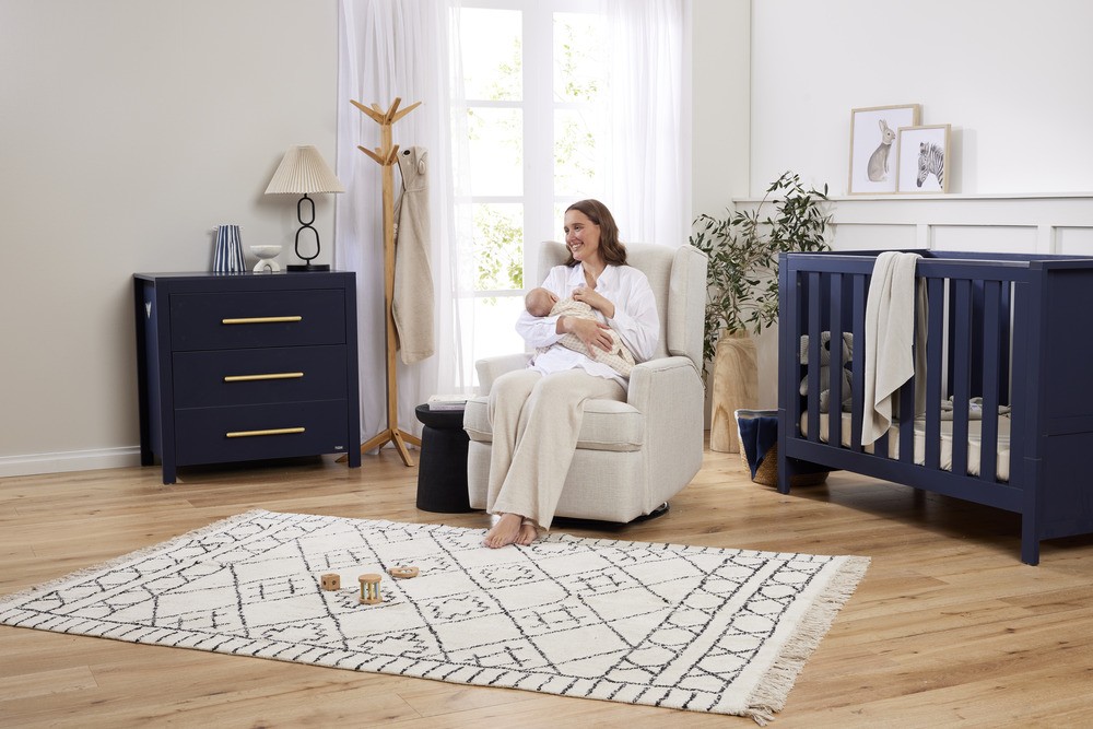 Mum breastfeeding her baby using the iltutto Chelsea Glider in Egg Shell – the best nursery rocking chair for modern Australian homes.