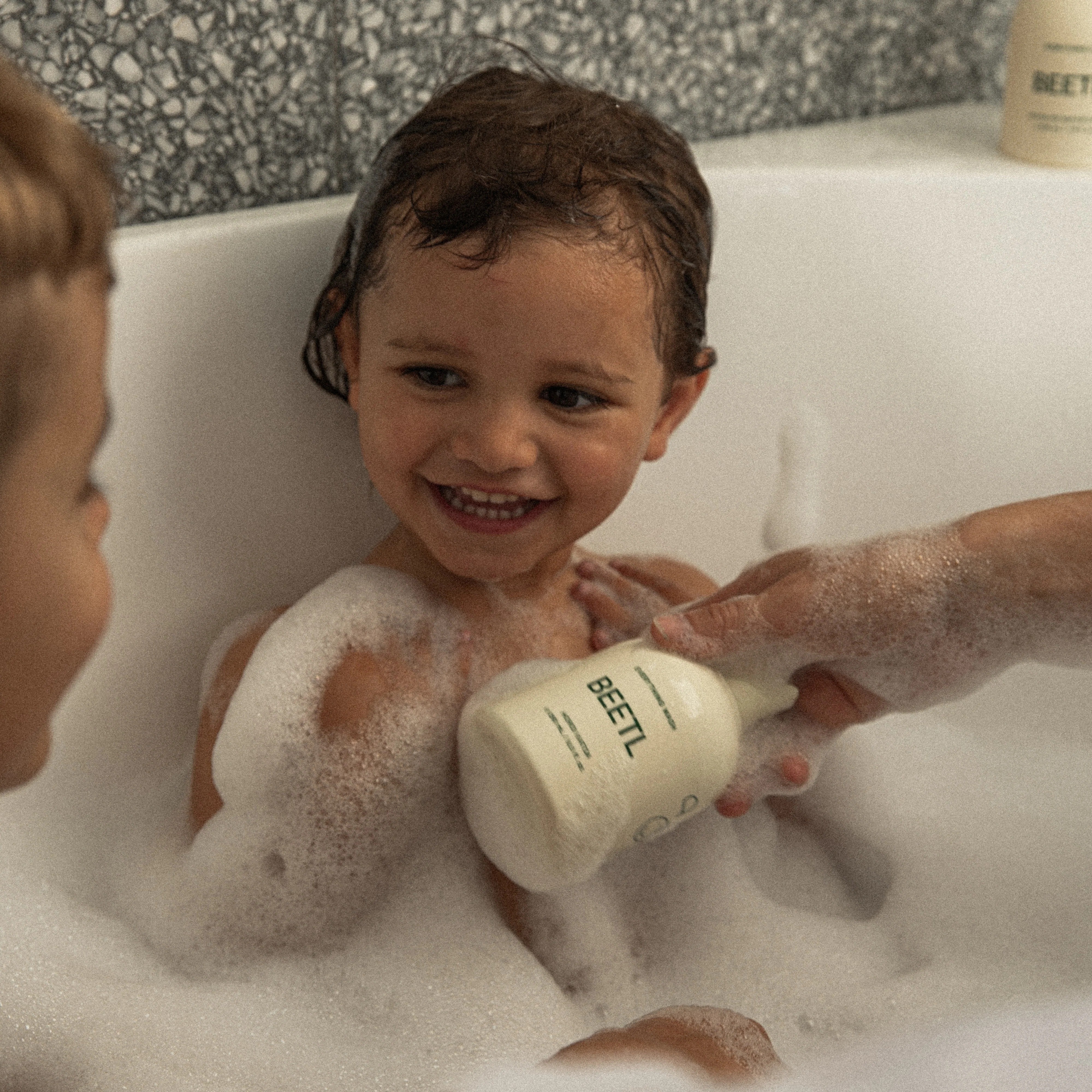A baby using BEETL skincare