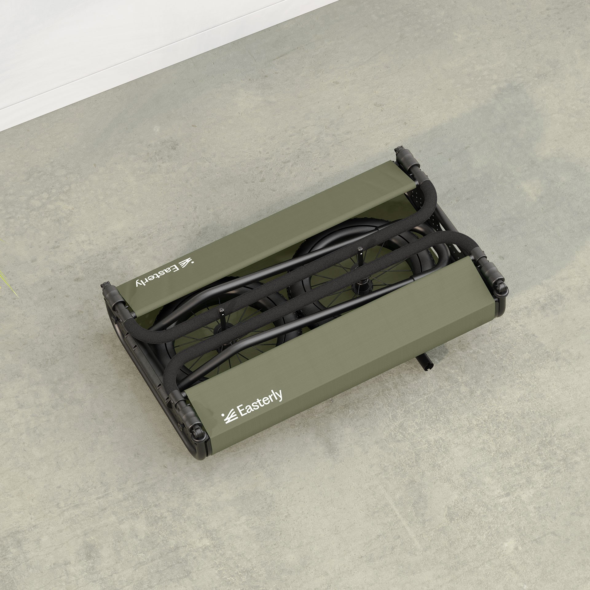 Compact folded beach cart ready for storage in a home garage or vehicle boot.