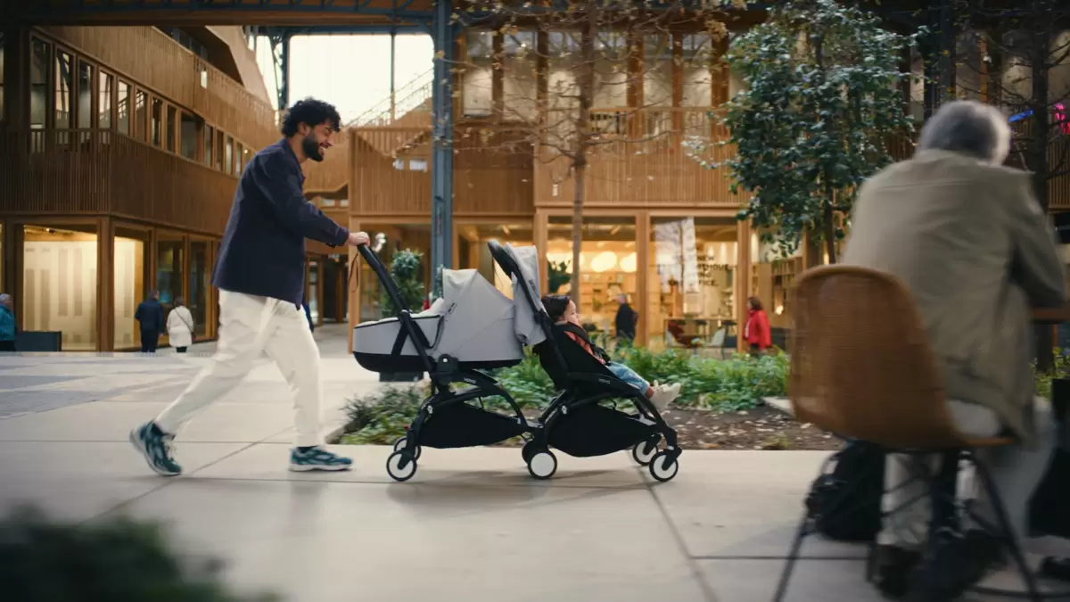 Dad with baby in the best travel pram in Australia, designed for comfort and convenience.
