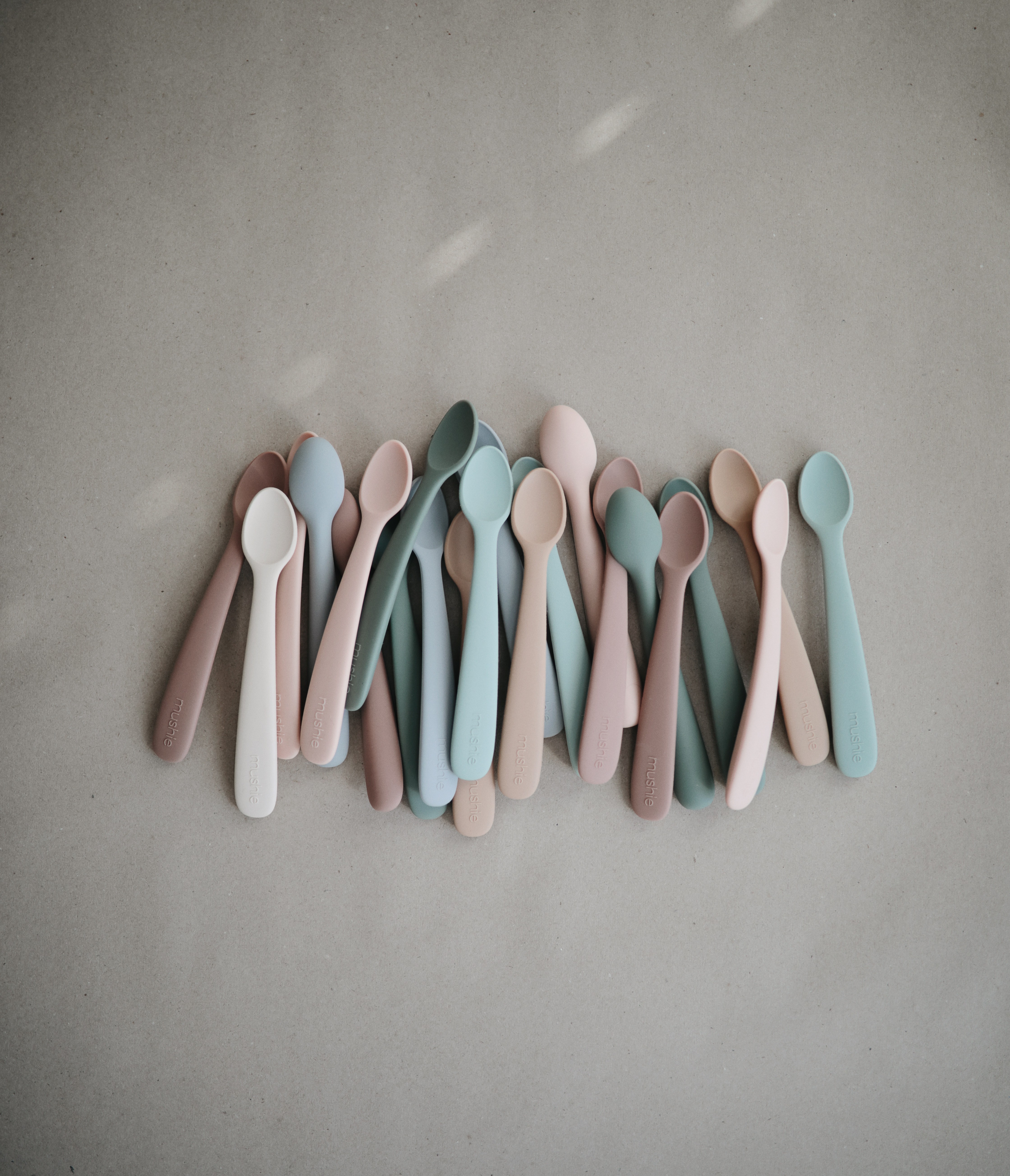 Mushie Silicone Feeding Spoons 2 Pack in a flatlay, ideal Best Feeding Essential for introducing baby to solids.