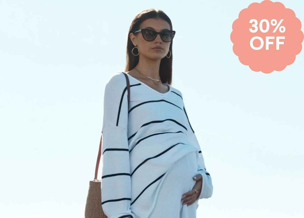 a pregnant woman in a stripe top