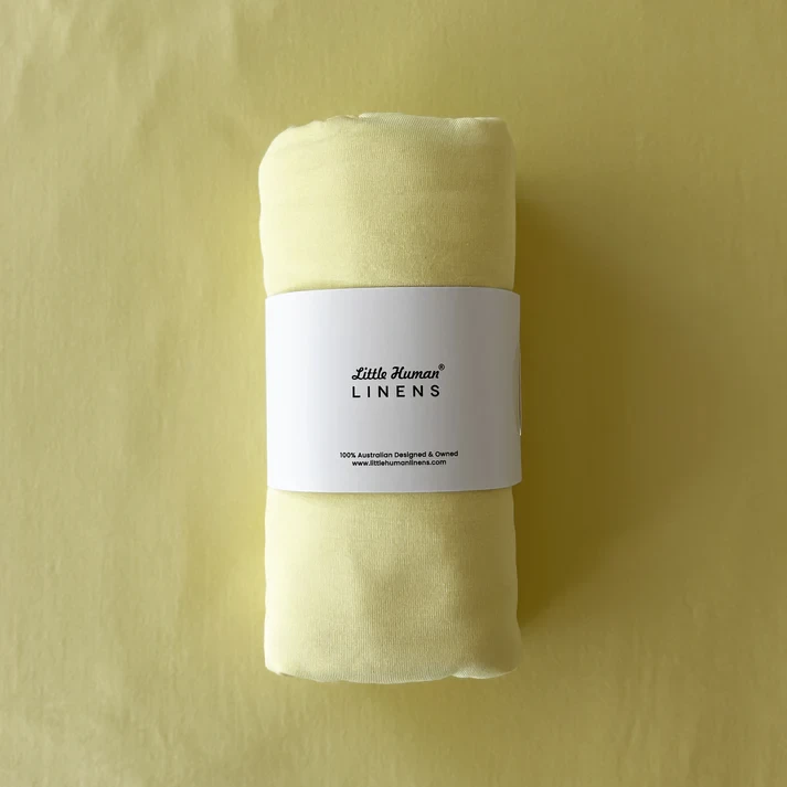 Little Human Linens swaddle in yellow