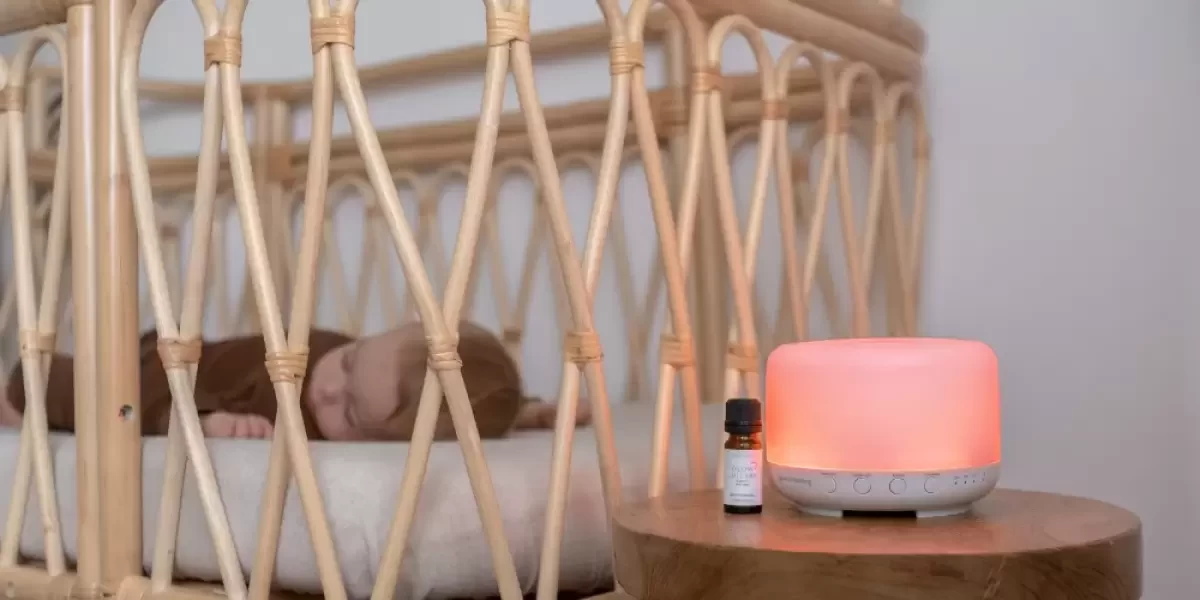 A red baby night light next to a crib