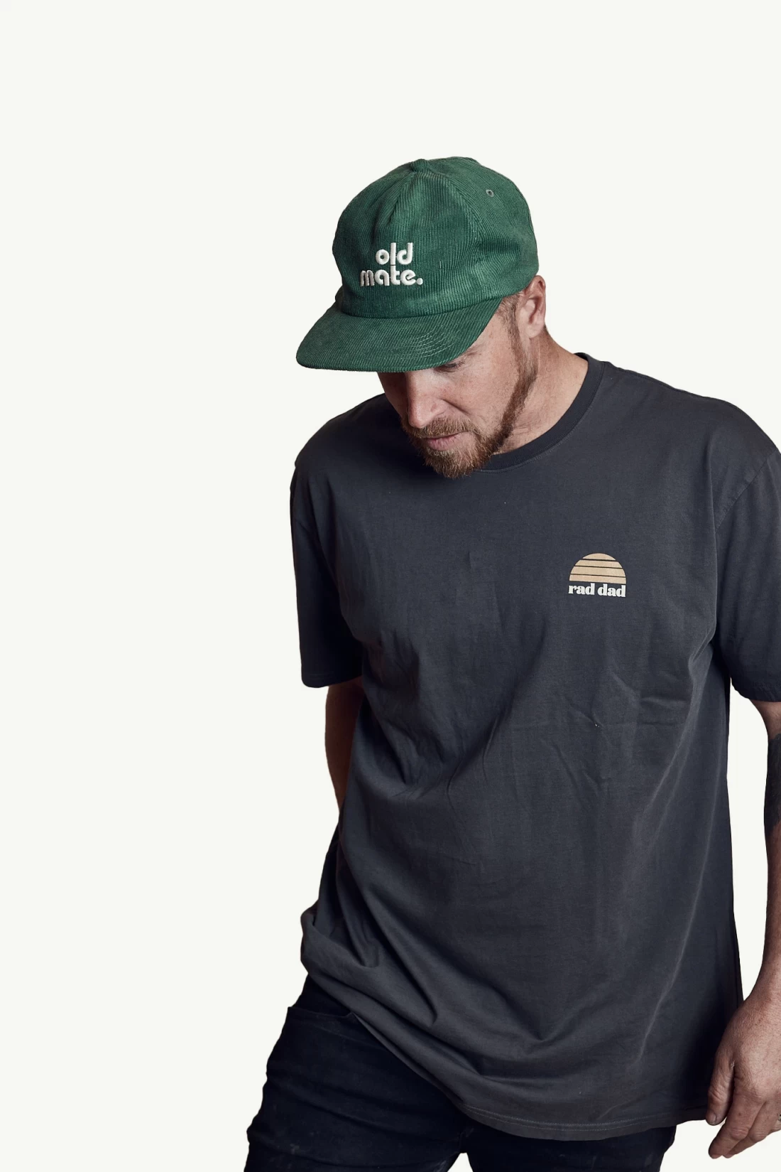 Stylish dad in a black shirt and green cap isolated on white background, showcasing the Best Father’s Day Gift look.