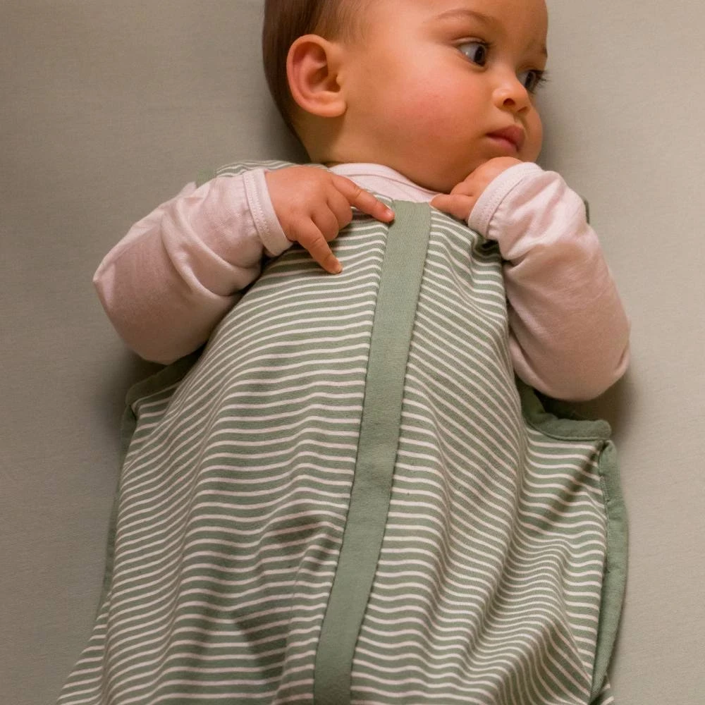 A baby in a wool and cotton summer baby sleeping bag