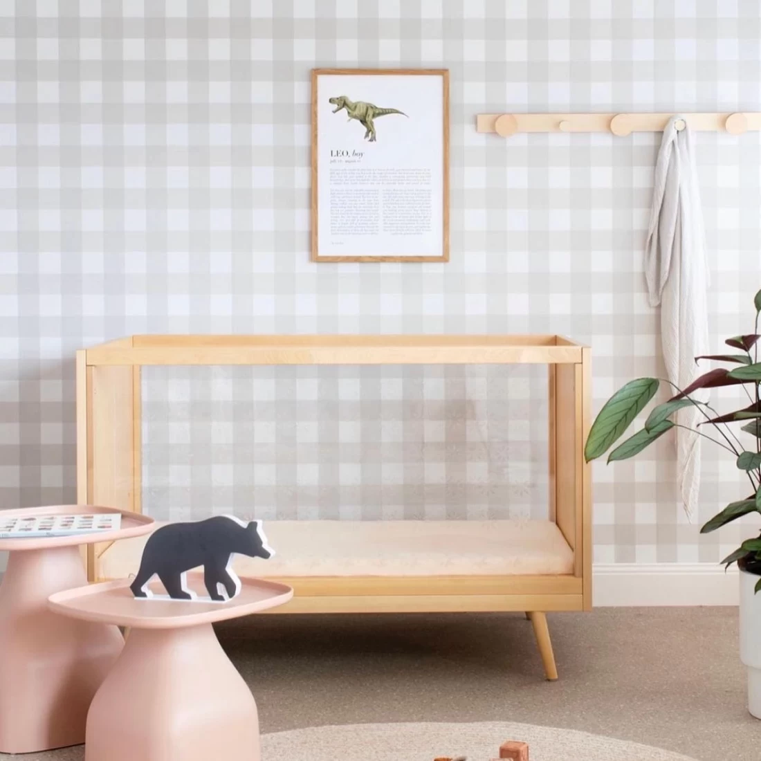 Minimalist checkered wall art styled in a baby nursery, showcasing the best nursery decor ideas.