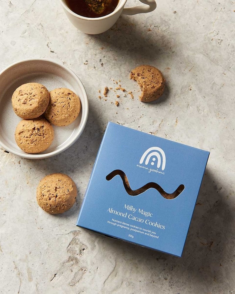 lactation biscuits set on a plate next to a blue box
