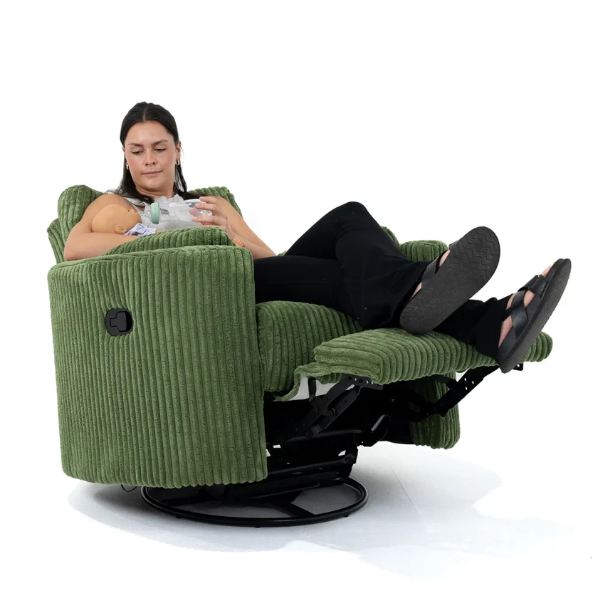 The Fluff Daddy Fluff Mumma recliner rocking chair in action, with a mum feeding her baby while sitting in it