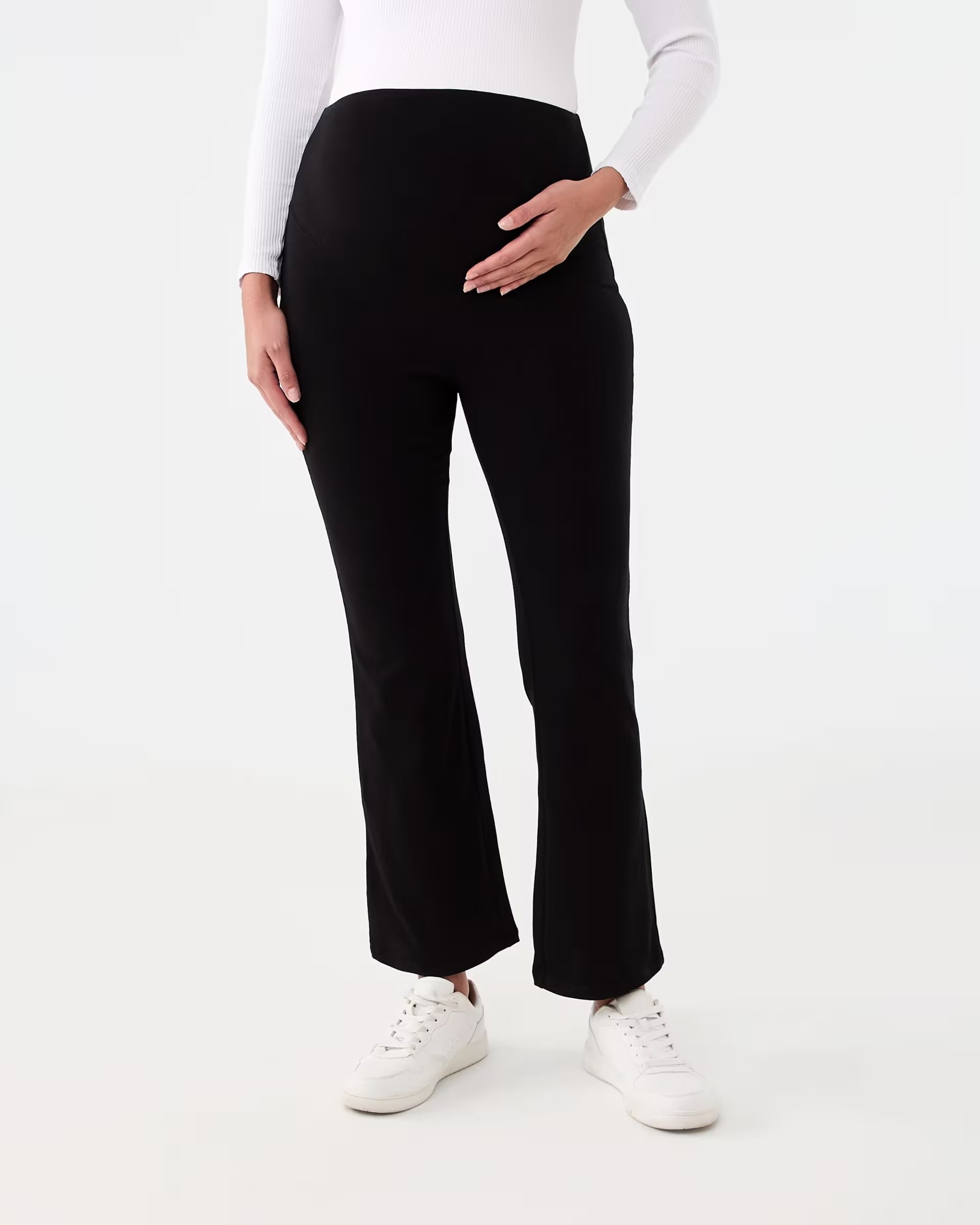A shot of Kmart's maternity activewear leggings shown on a woman