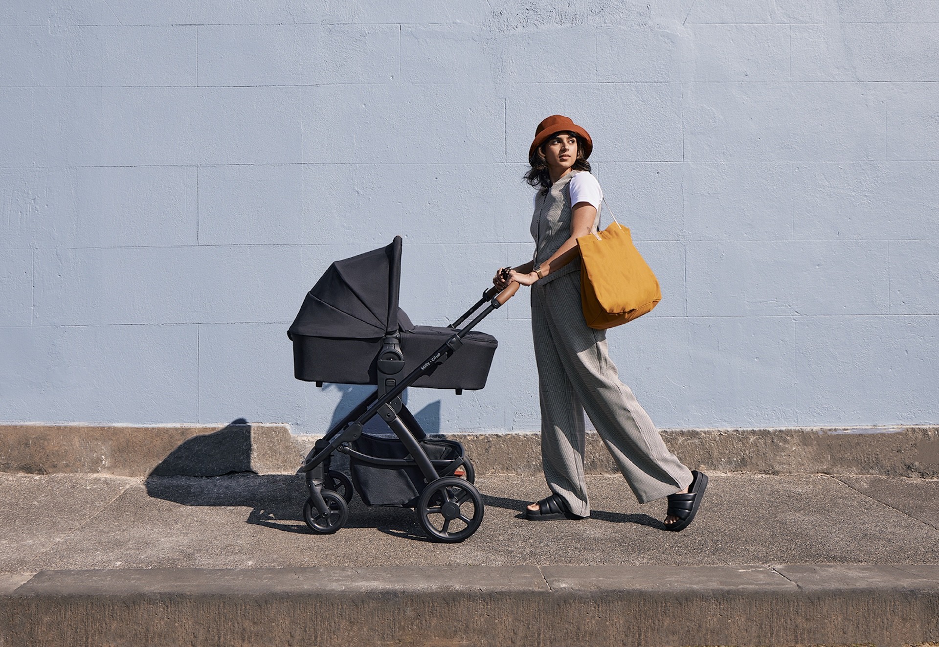 An Australian mum pushing the Milly + Coup Milo2 pram