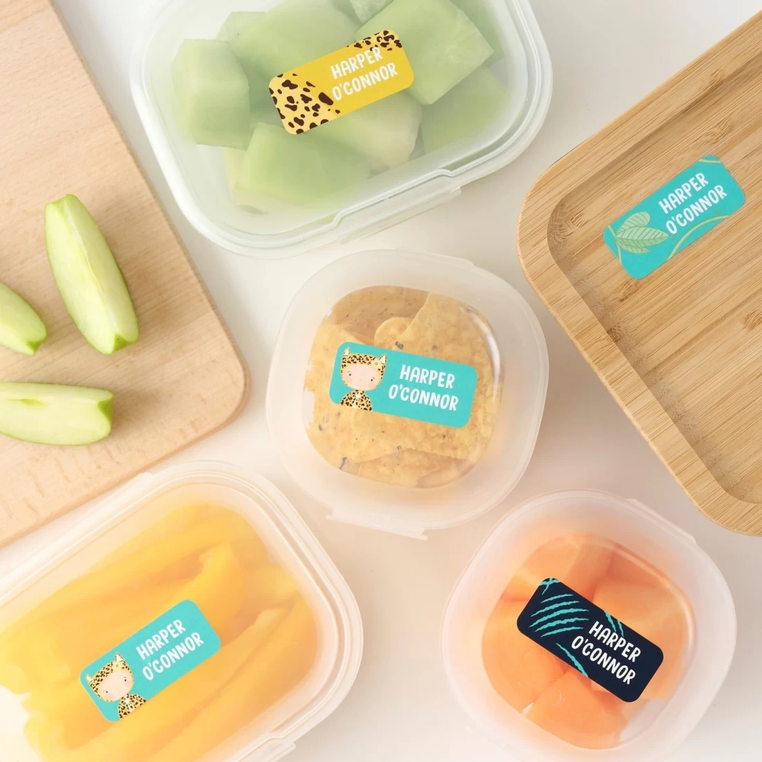 Flat lay of nutritious homemade meals and custom labels designed for the best baby boy.