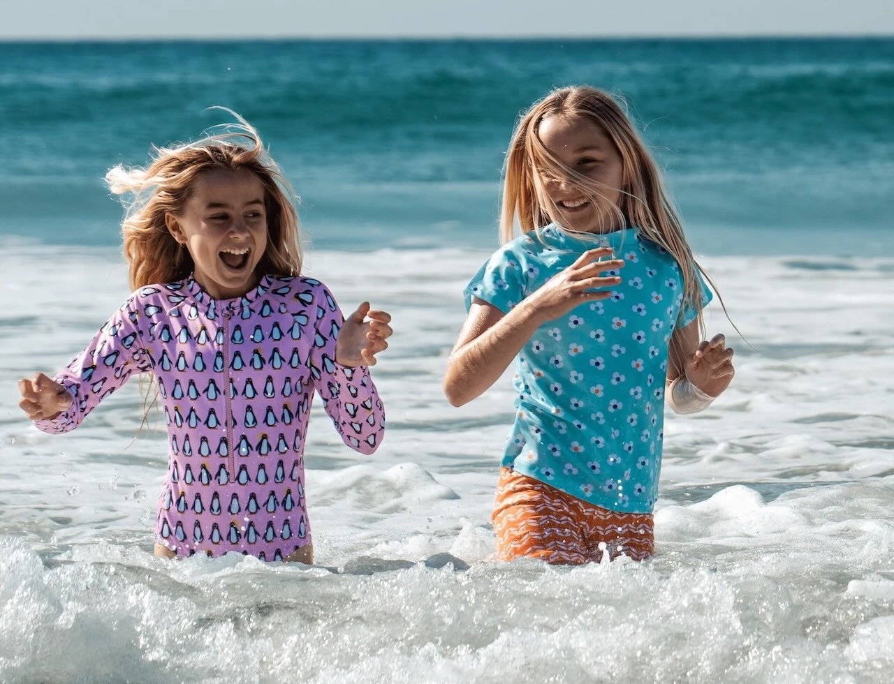 two girls playing at the beach