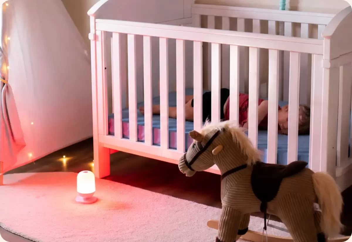 a red light white noise machine in a nursery