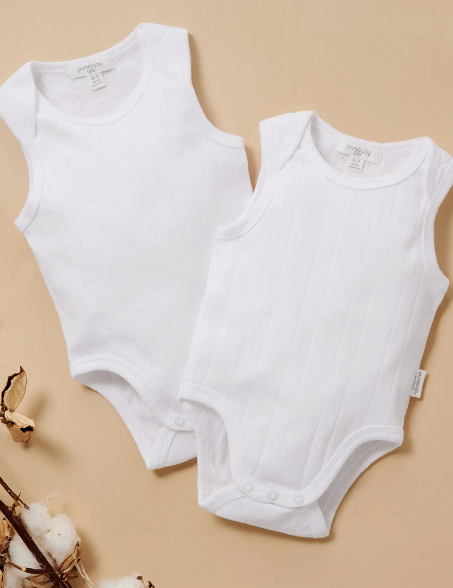 two newborn bodysuits by purebaby, a newborn essential in australia