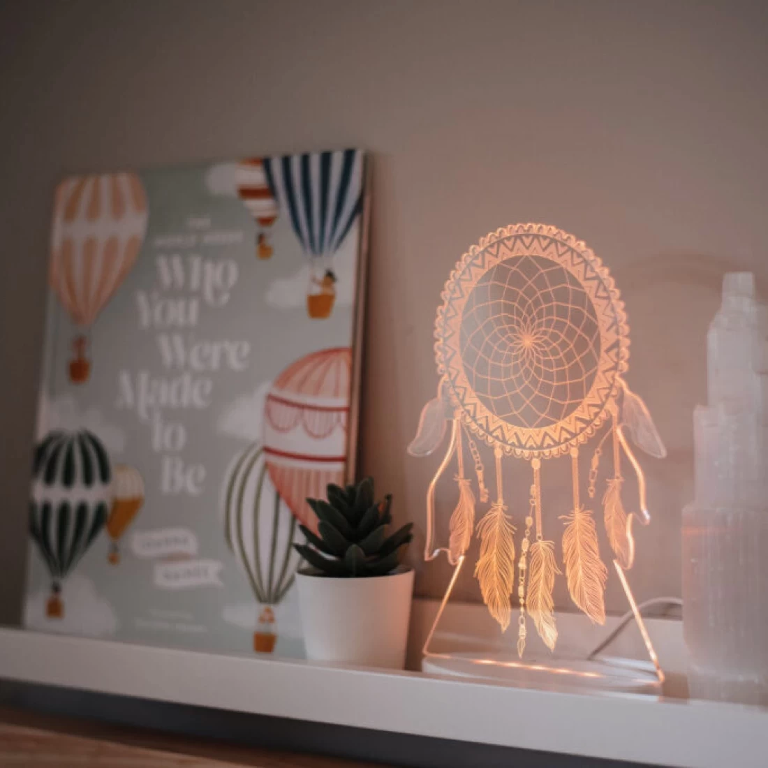 Night light glowing on table next to board, one of the best night lights.