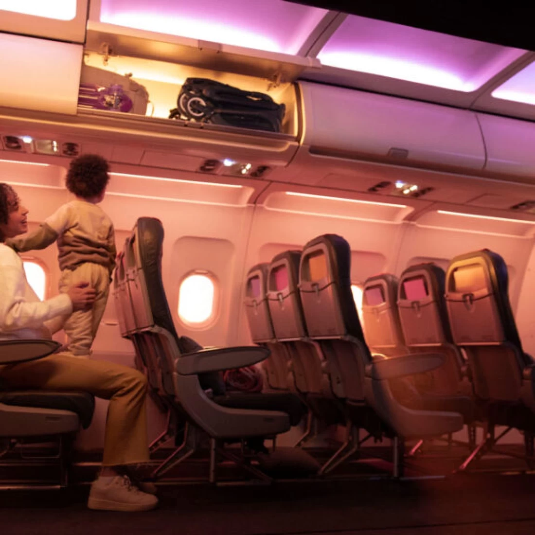 The Bugaboo Butterfly 2 shown stored on a plane in the overhead locker