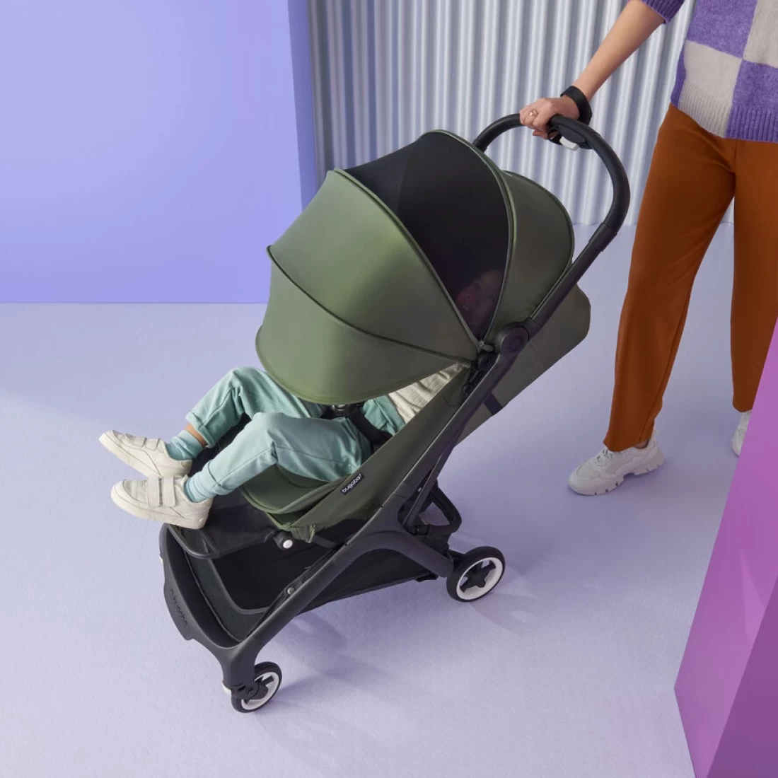 A baby sleeping in the Bugaboo Butterfly 2 travel pram