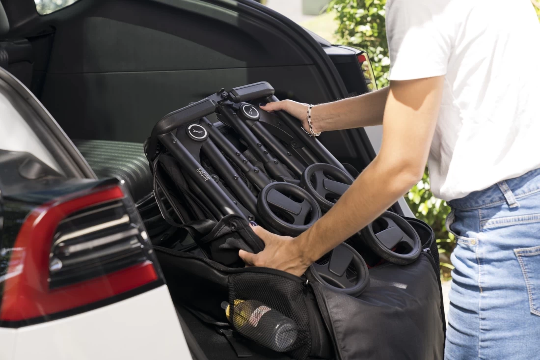 Karion Kids Best Travel Stroller folded neatly at the back of the car, ready for family adventures