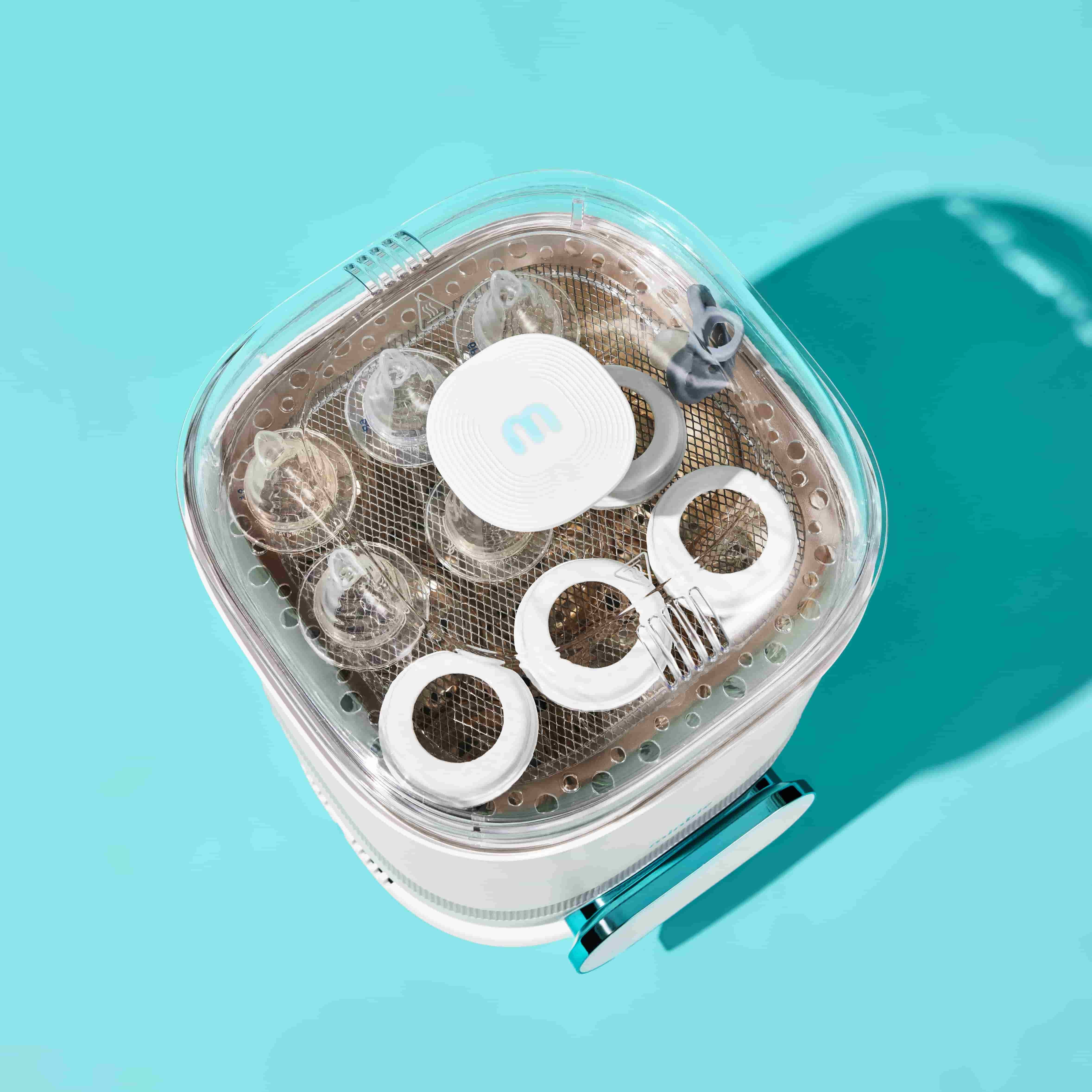 Minbie steam steriliser and dryer interior featuring multi-level design for bottles and dummies – safe and efficient for busy Aussie parents