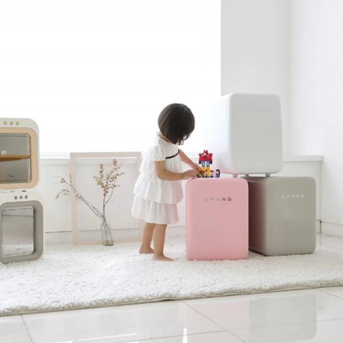 Smiling baby girl with a baby steriliser trusted as the best baby brand in Australia.