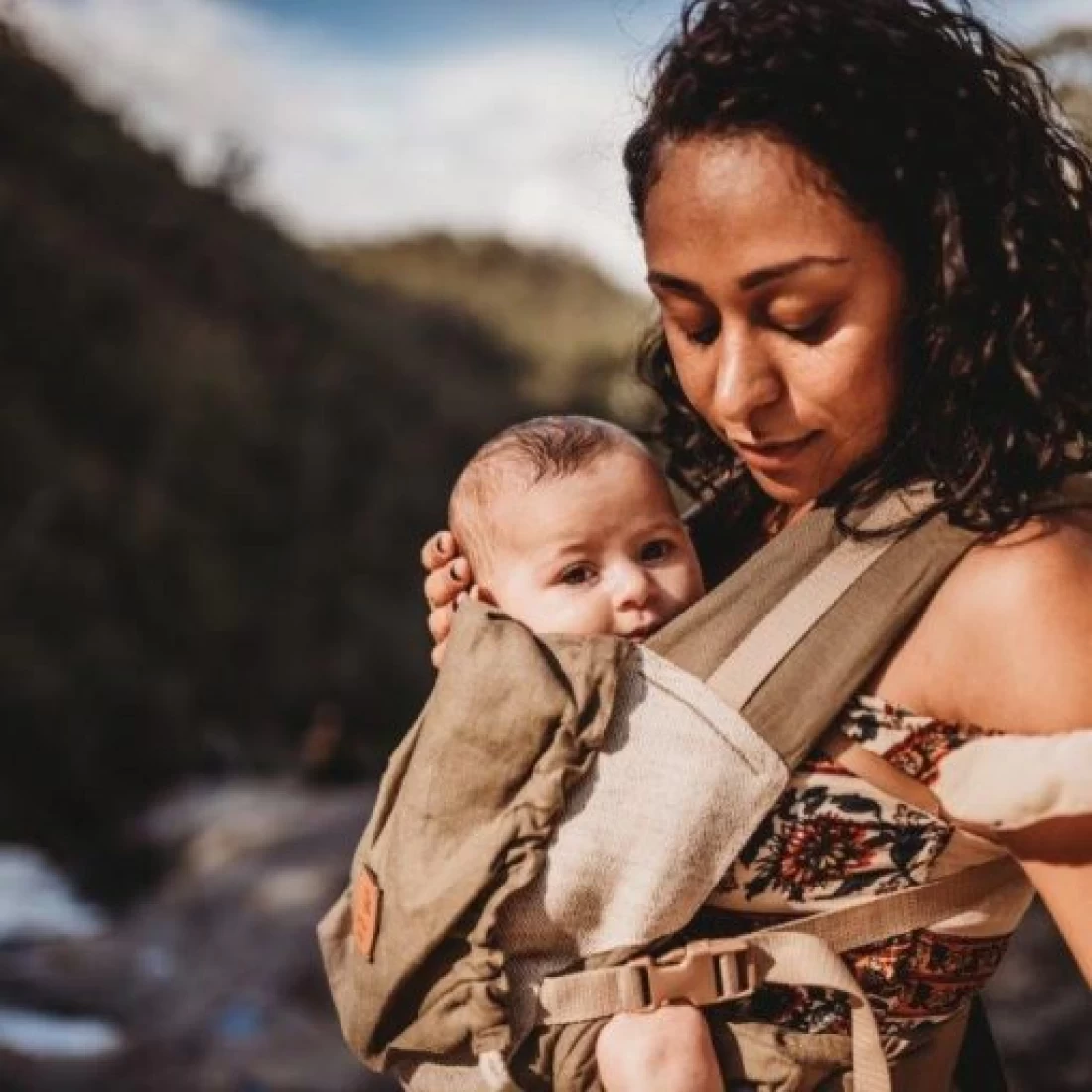 Mum carrying her baby in a comfortable baby carrier from the best baby brand.