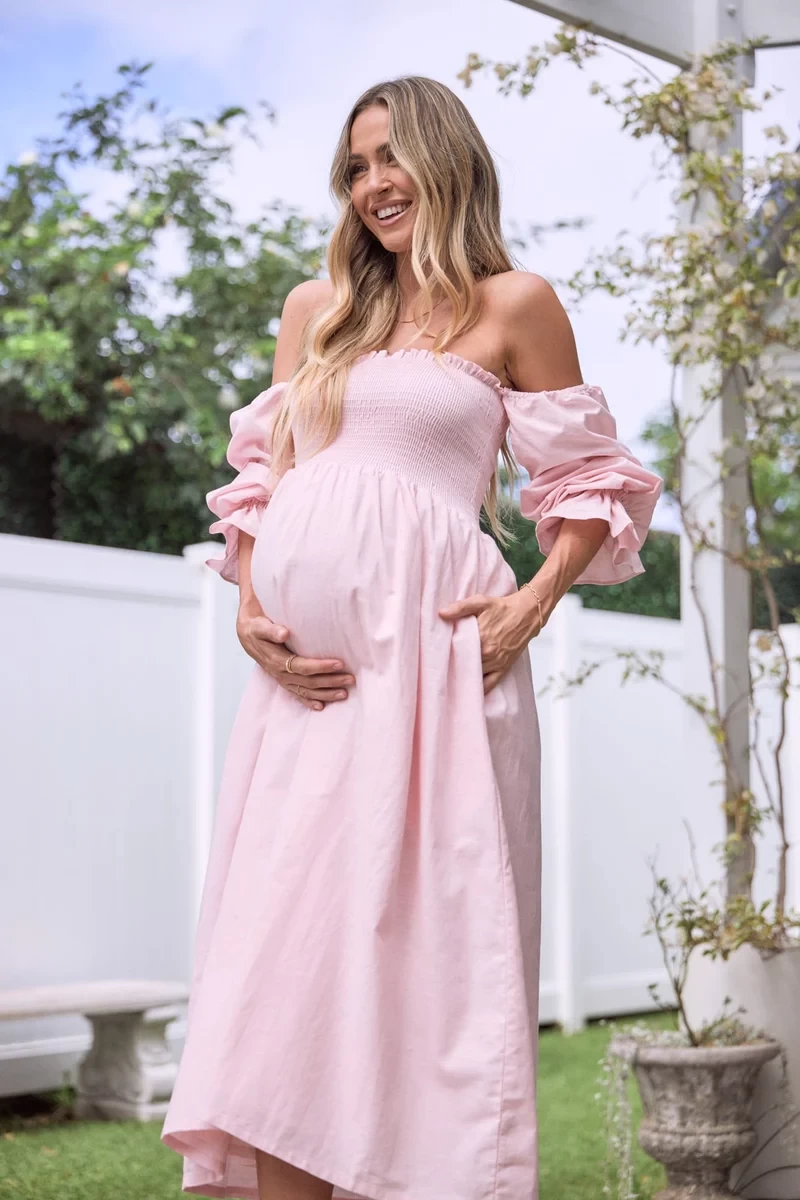 A baby shower dress in pink by petal and pup