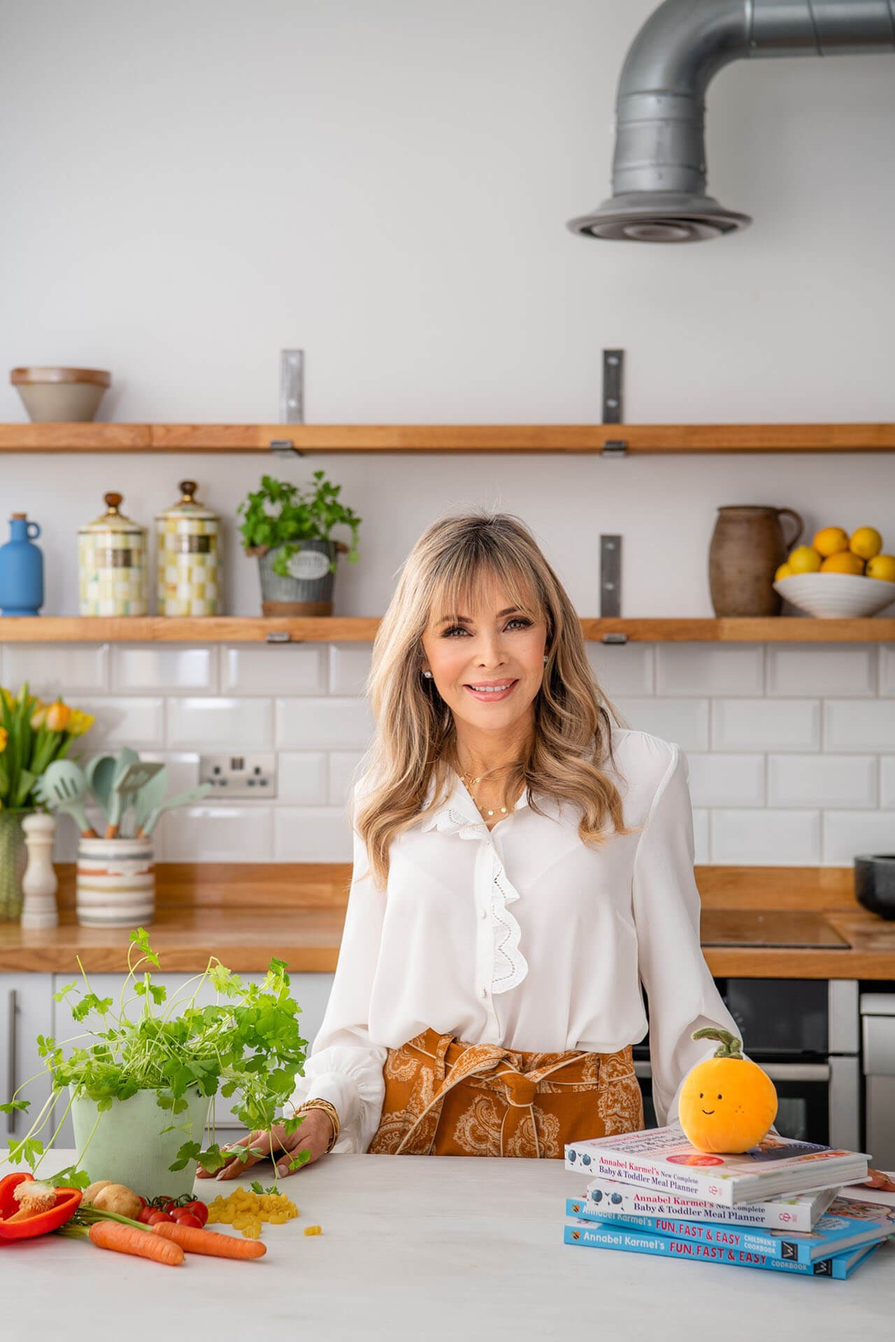 Annabel Karmel wearing white long sleeve top baby led weaning expert
