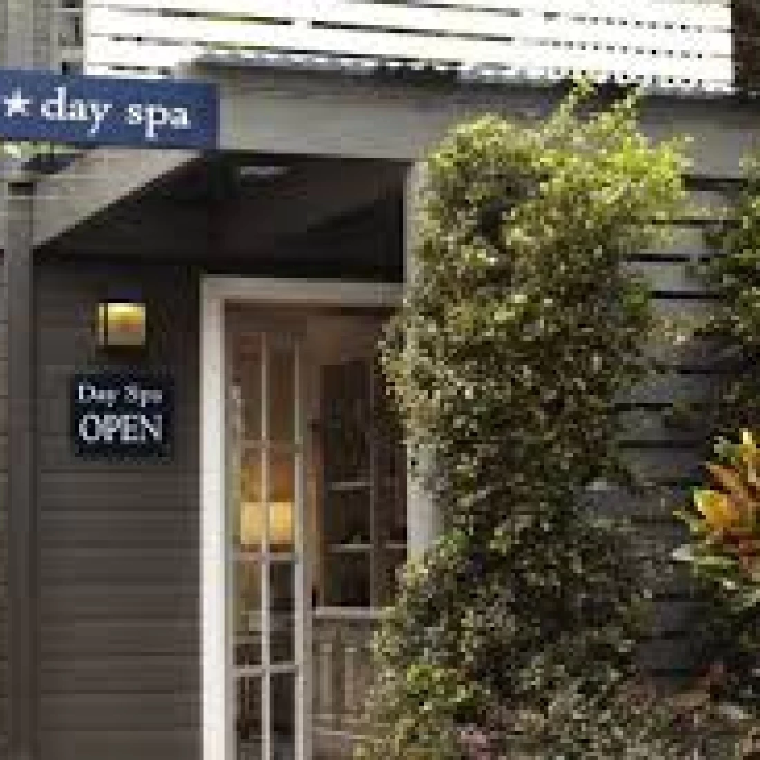 Pregnant mum enjoying the Best Pregnancy Massage at a serene outdoor spa.