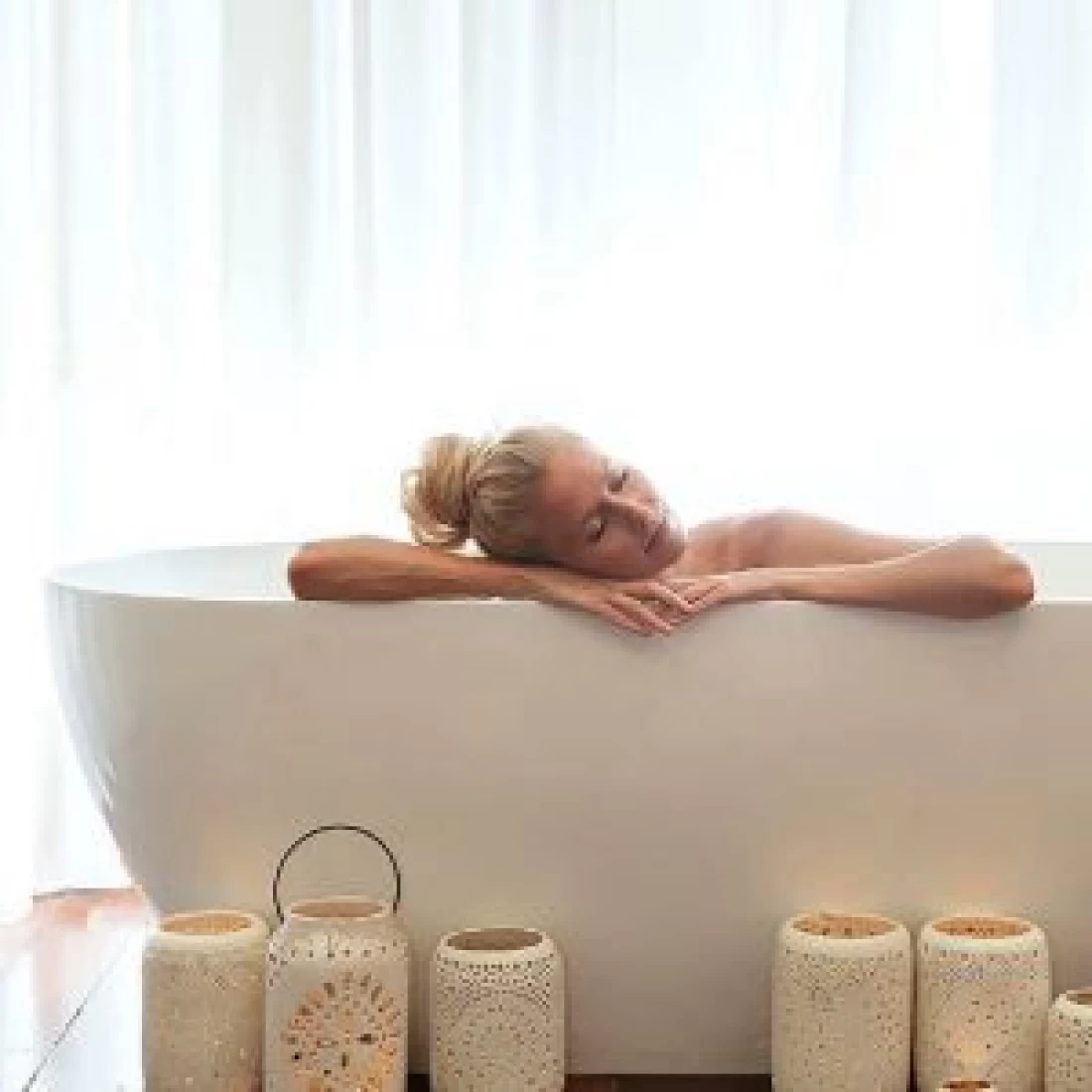 Woman in a luxury bath tub at a spa offering the Best Pregnancy Massage treatments
