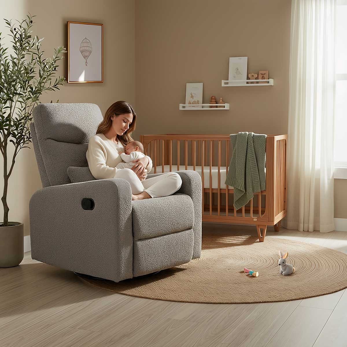 Cocoon Glider Recliner Arm Chair with an Australian mum sitting in it, cradling her baby