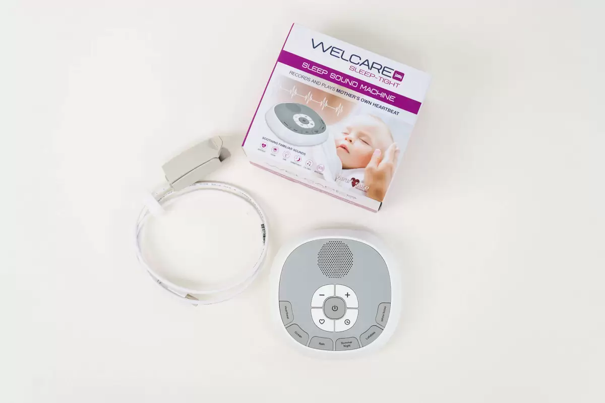 Complete view of Welcare Sleep Sound Machine set – machine, box, and cable shown on white background, labelled among the best white noise machines in Australia.
