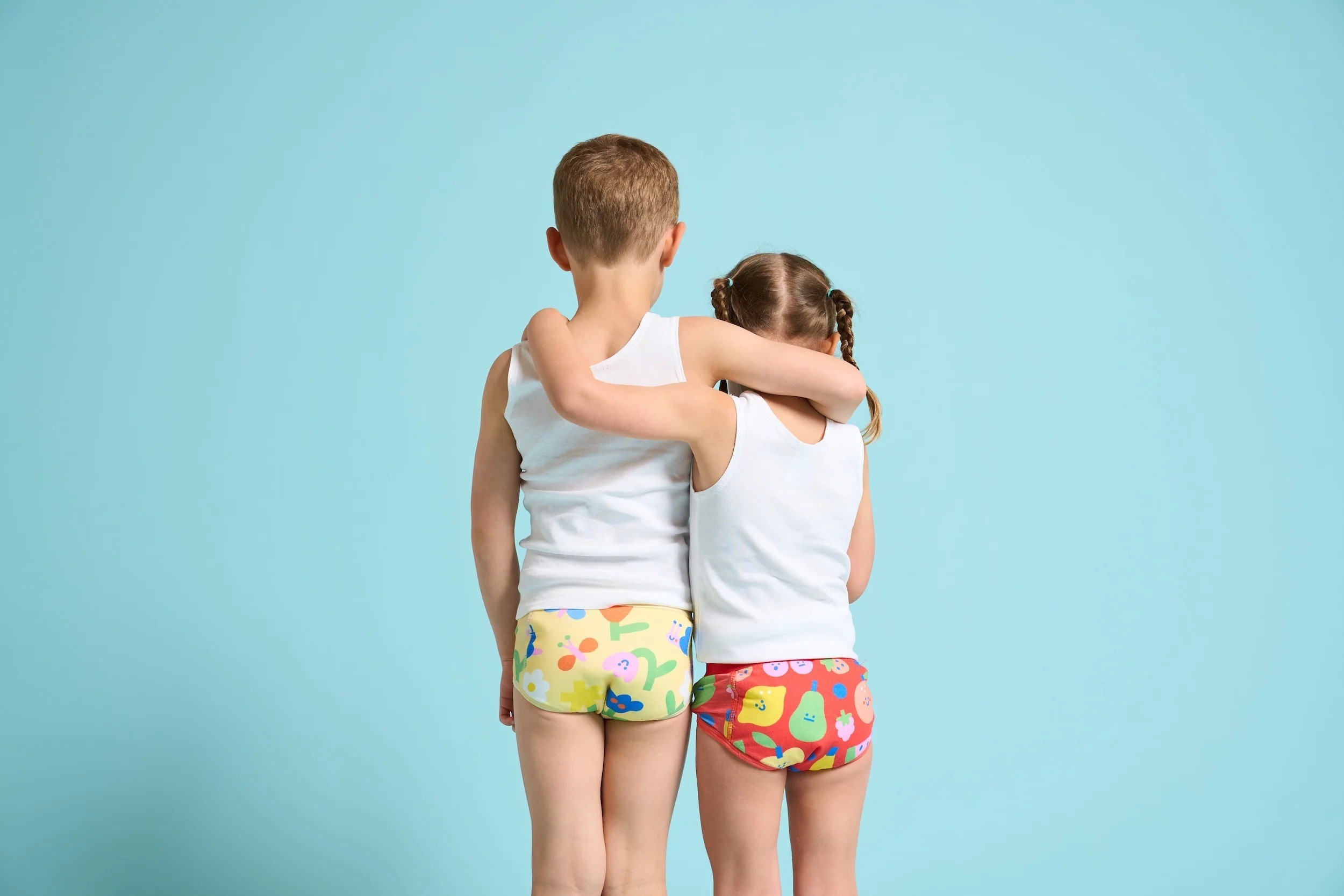 Two kids wearing cubby bubs pants