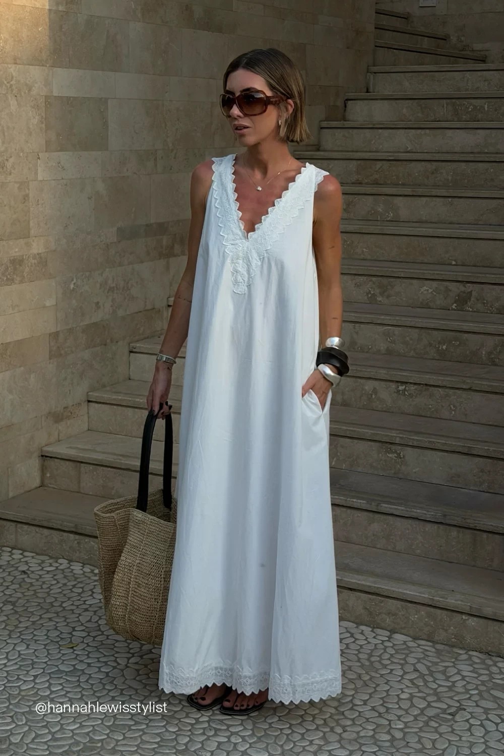 A white floaty baby shower dress by Dissh