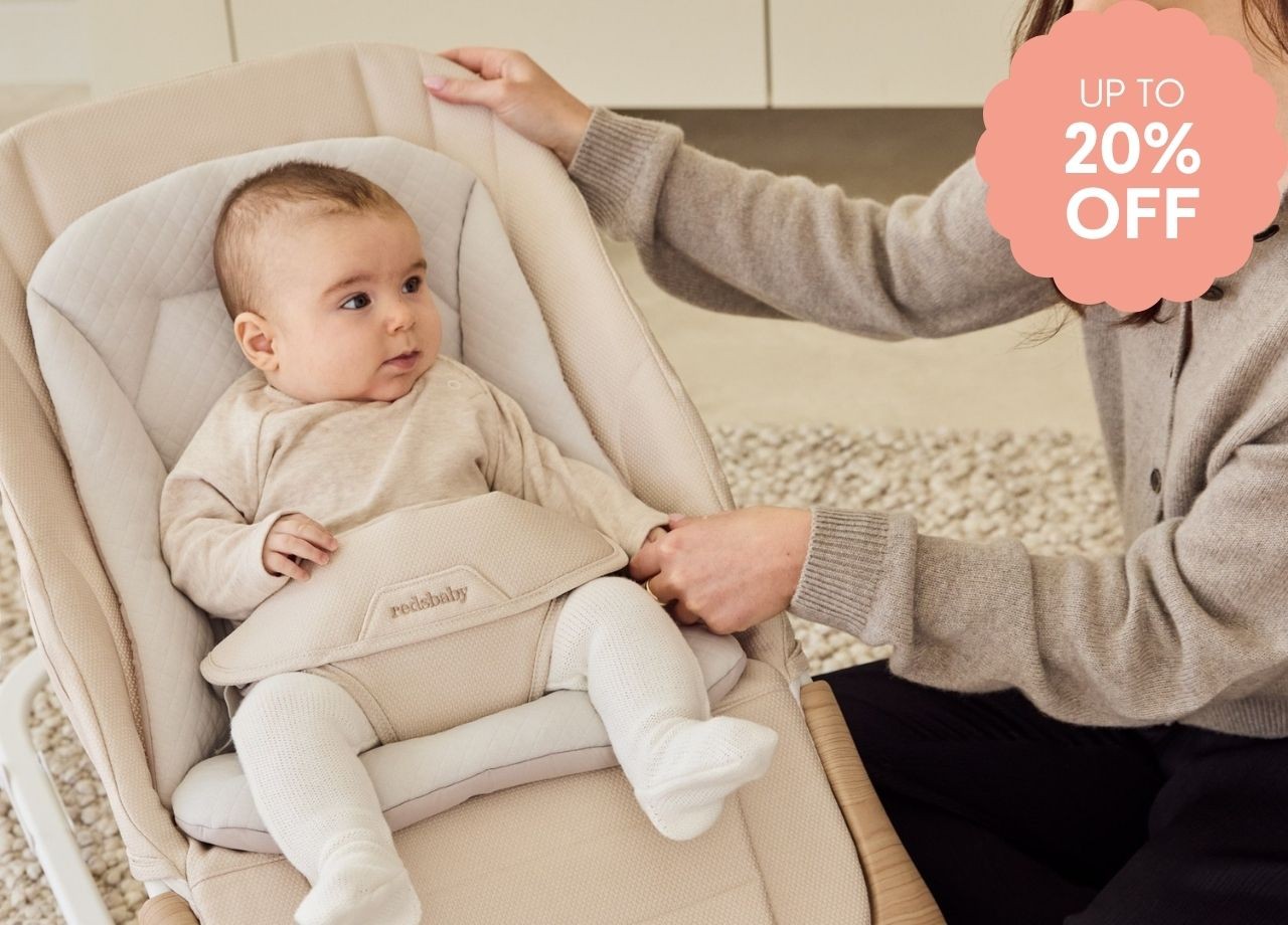 A baby being soothed in a play rocker
